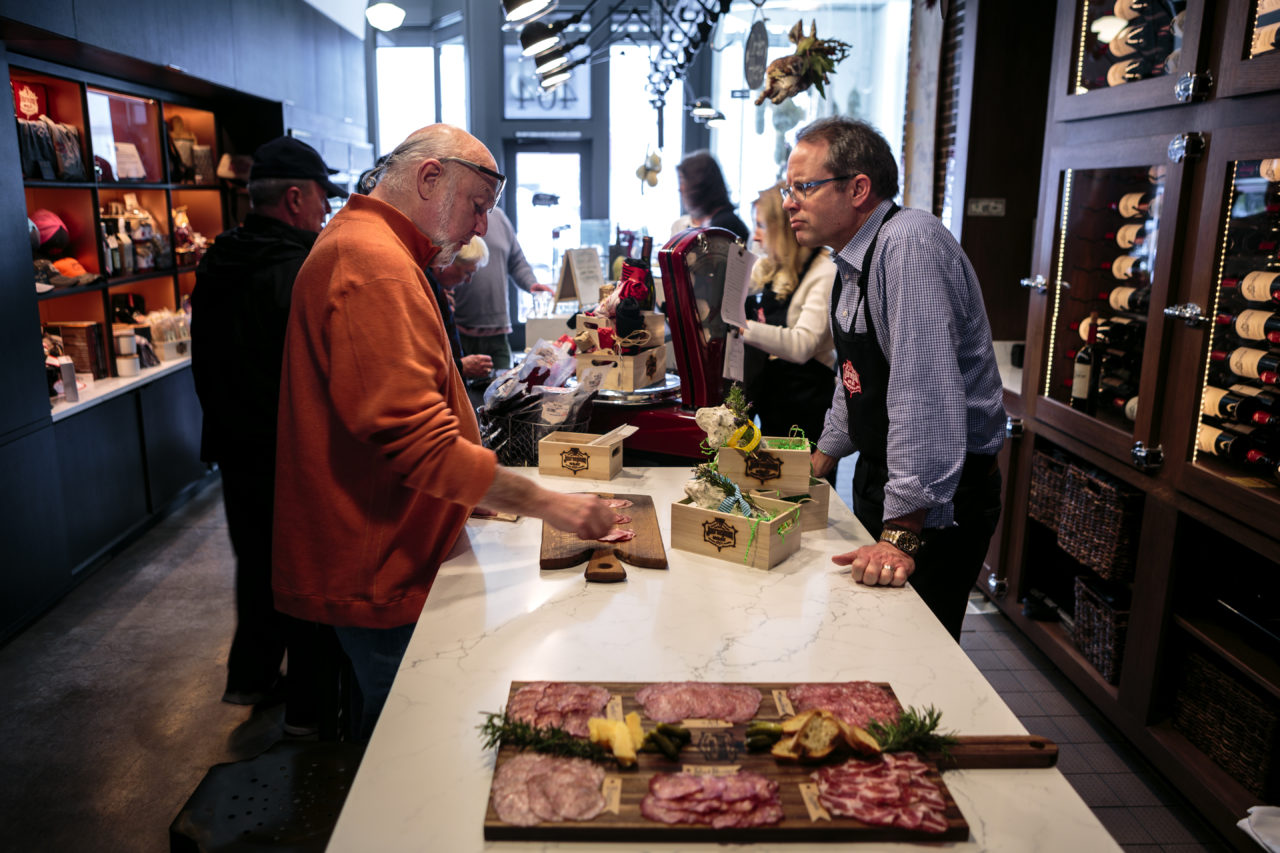 Journeyman Meat Co. owner Peter Seghesio chats with a customer.