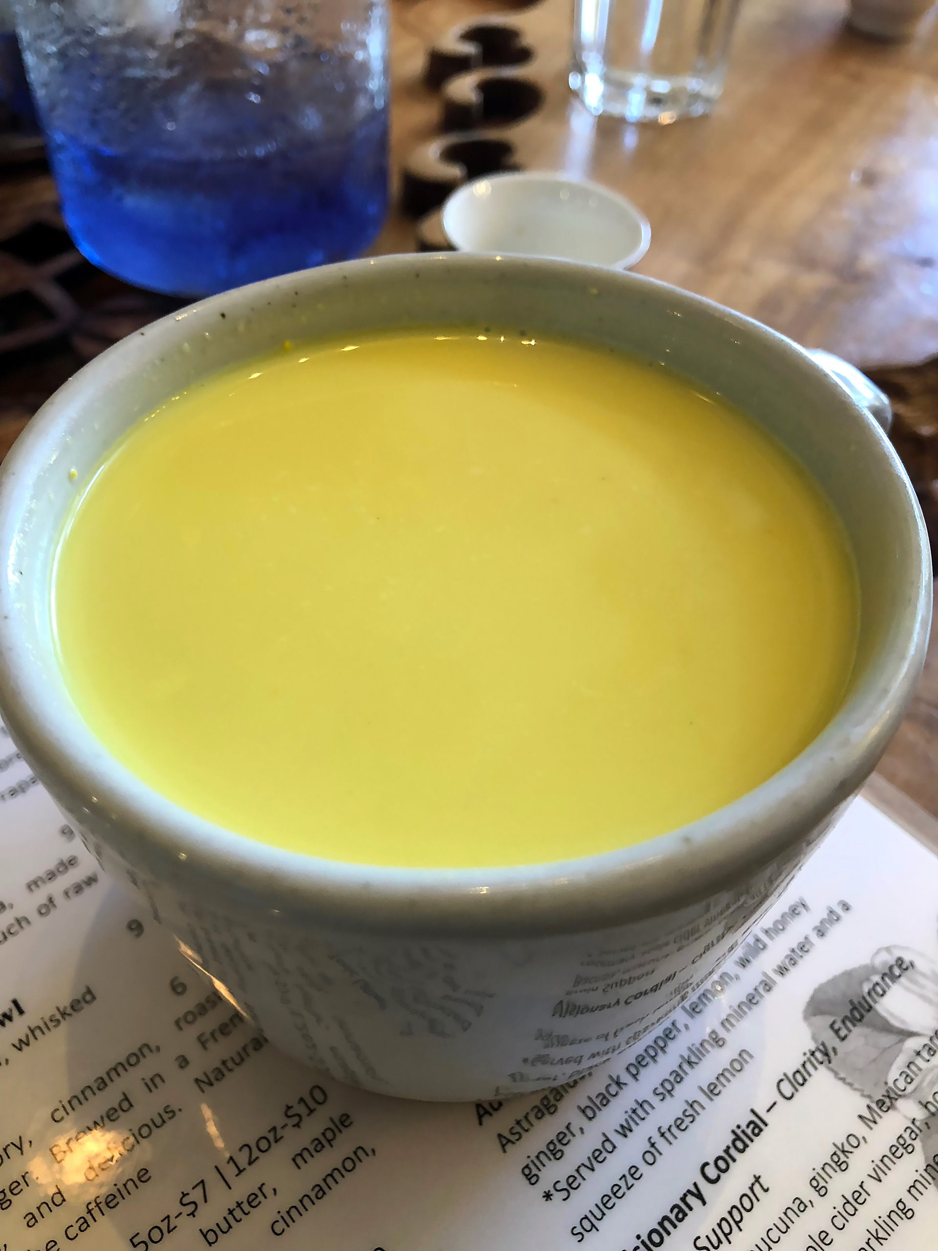 Golden Milk: A sultry blend of organic turmeric, ashwagandha, ginger, cardamom, clove, black pepper and vanilla in homemade nut milk with a touch of raw local honey.