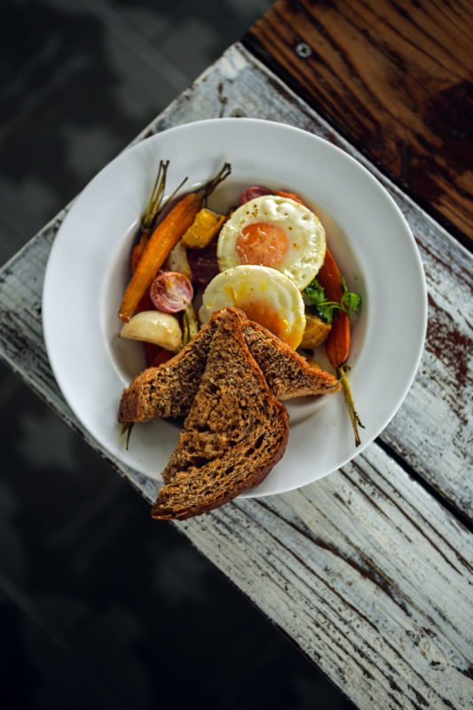 The Roots breakfast with eggs, roasted fall veggies and cracked whole wheat toast