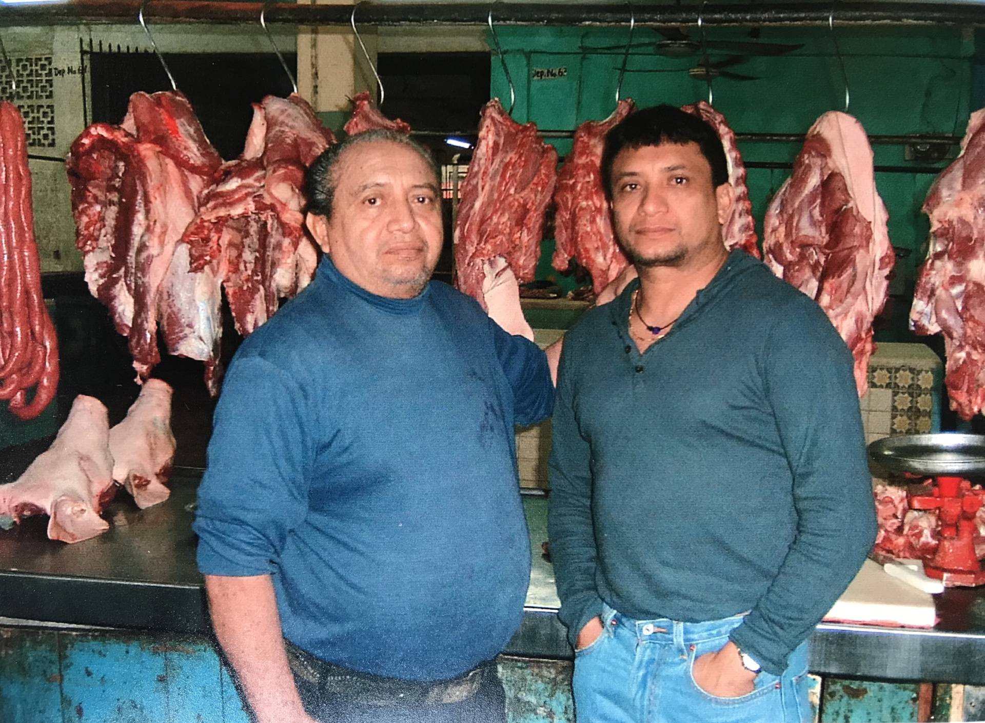 Mateo and father in the butchery