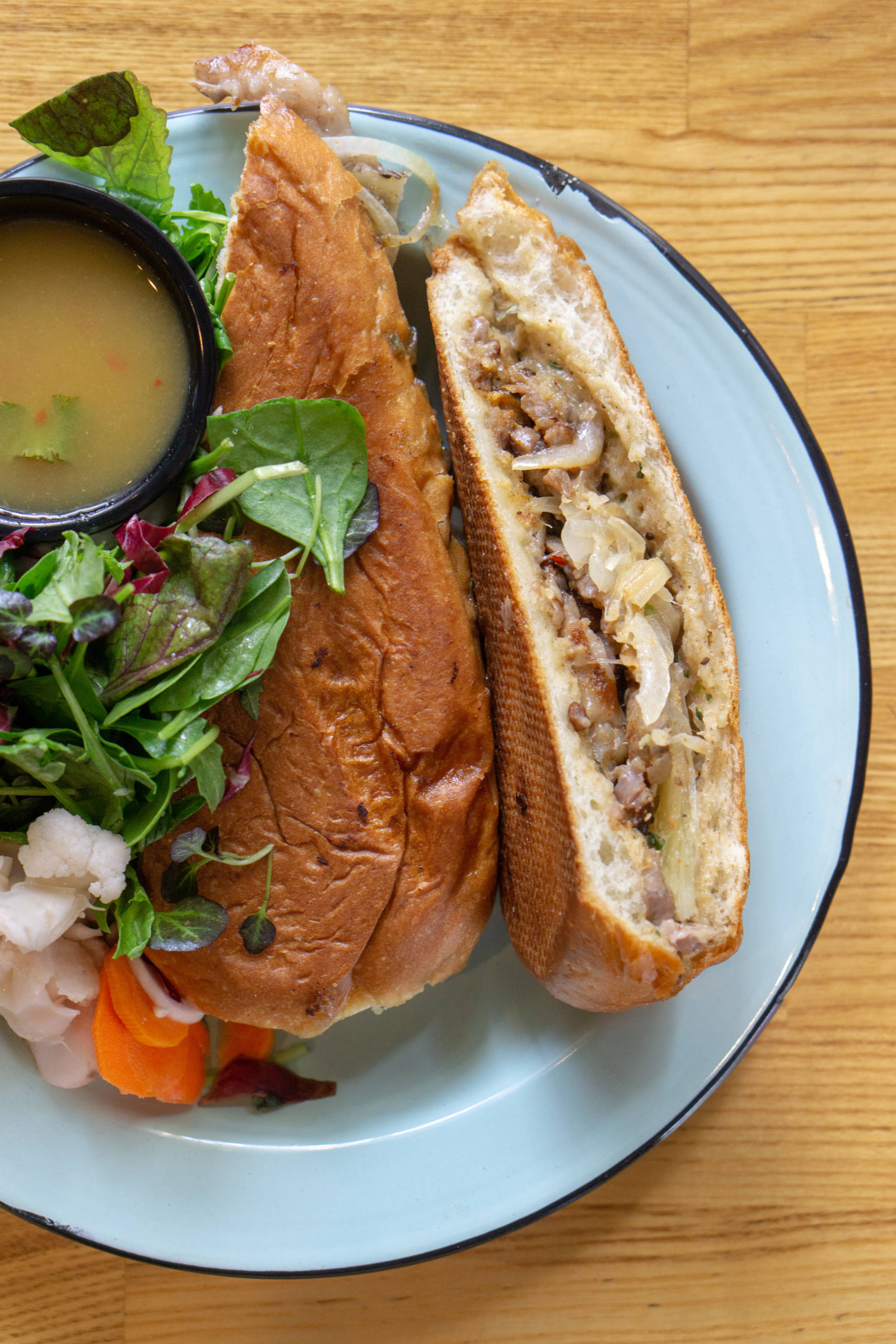 The Cubano comes with pickled vegetables, mixed greens and shoestring fries.