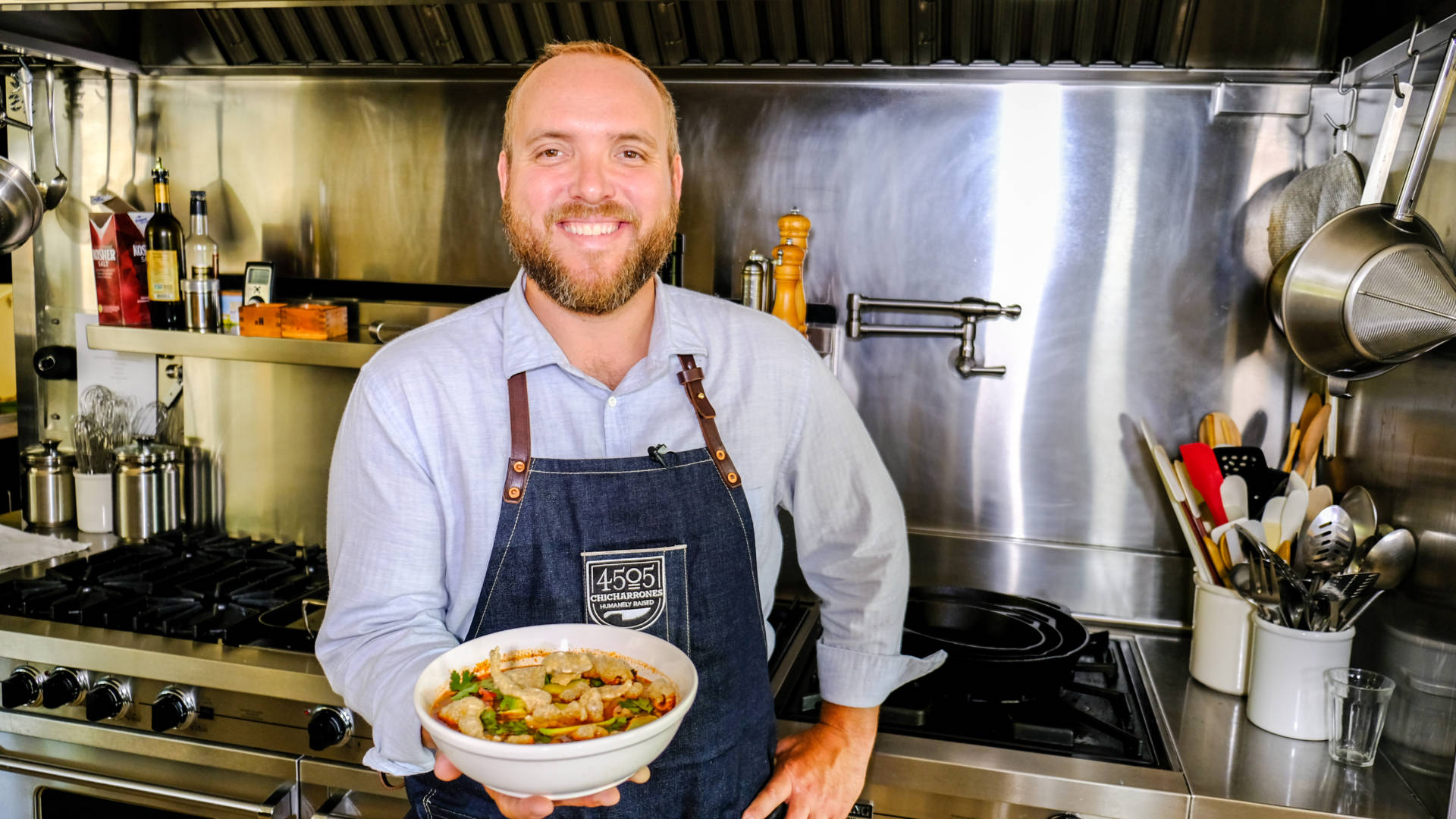 Chef Ryan Farr holds a bowl of his delicious holiday posole rojo.