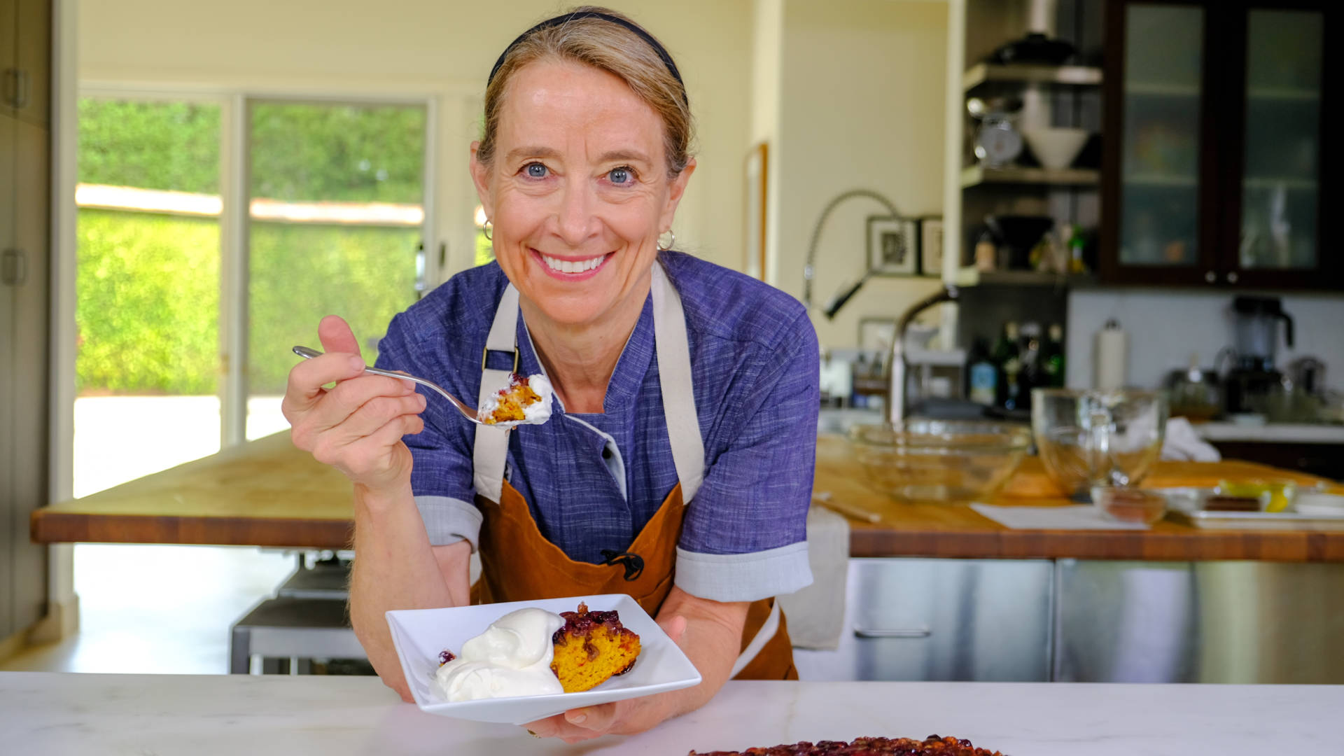 Chef Emily Luchetti with a slice of Pumpkin Upside-Down Cake.