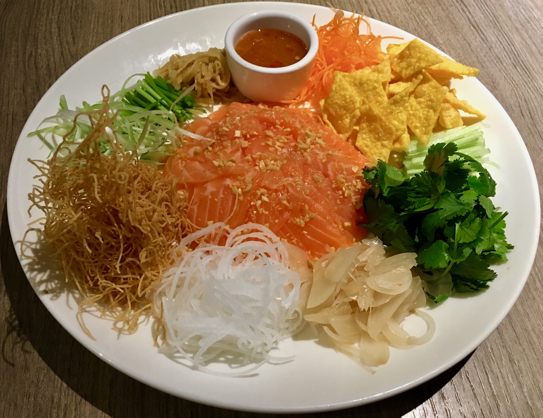 The "Prosperity Toss," a Cantonese-style raw fish salad.