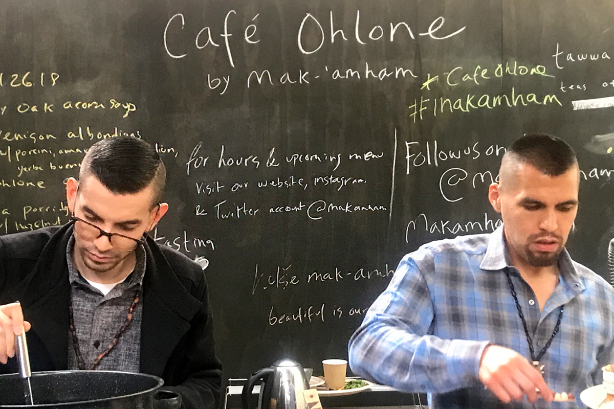 Louis Trevino (left) and Vincent Medina (right) cooking at Café Ohlone by mak'amham.
