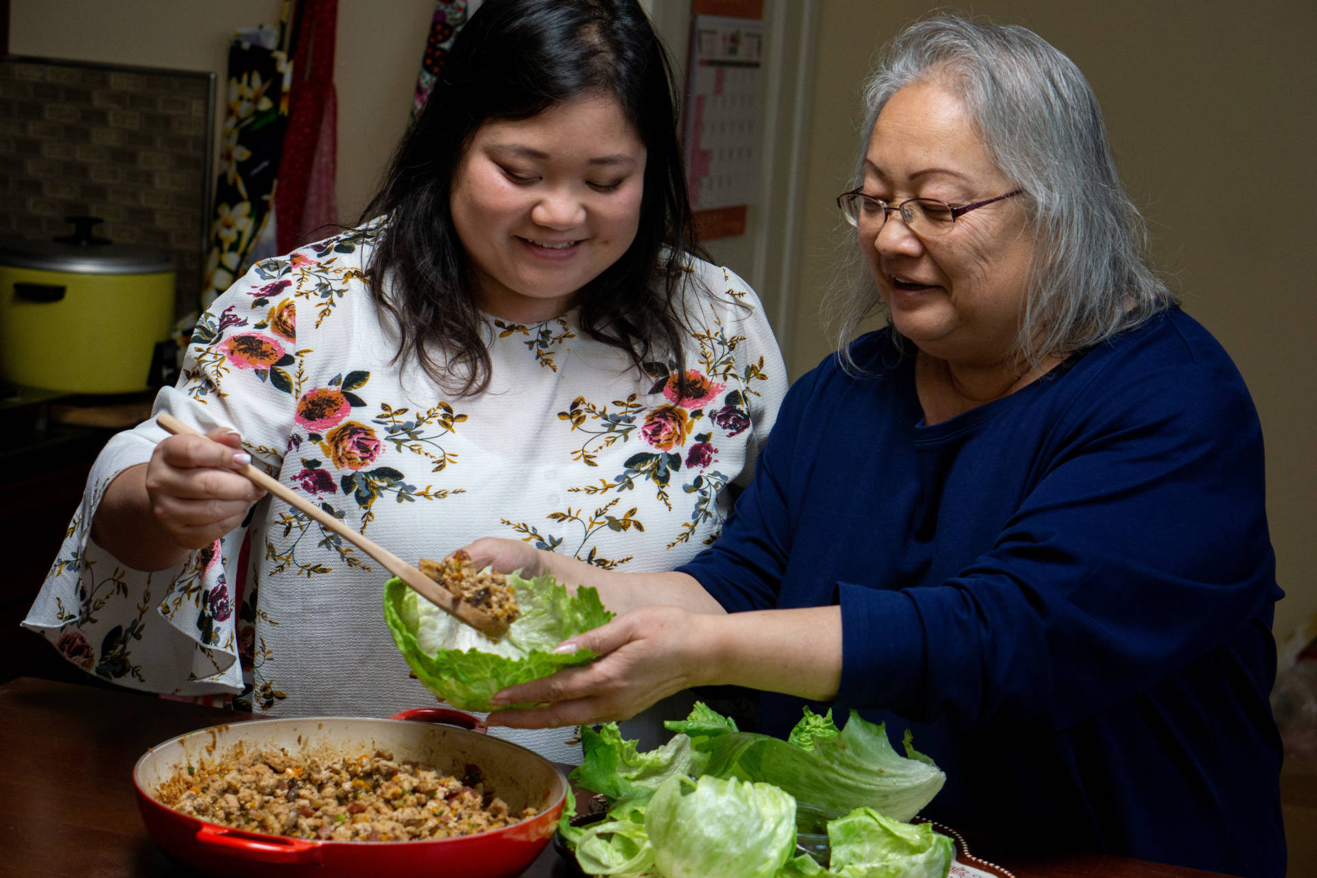 Cheryl and her mother, Diana, serve up some lettuce wraps.