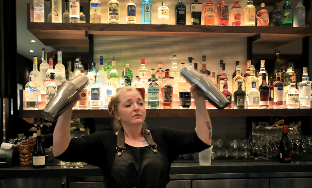 Sweet T's bartender Missy Lorenzen mixes drinks, Monday, March 4, 2019 during a soft opening of the restaurant's new location in Windsor. 