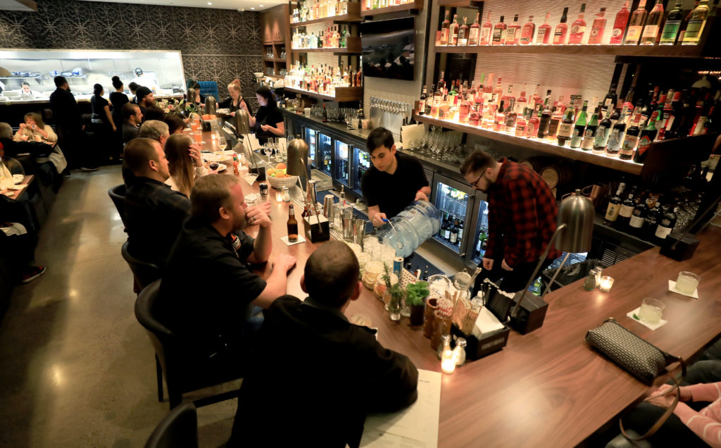 The bar is packed during a soft opening for Sweet T's in Windsor, Monday, March 4, 2019.