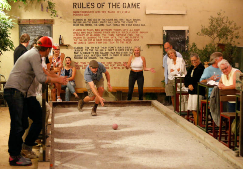 Dave White throws his bocce ball with style during bocce league play at Campo Fina restaurant in Healdsburg, California 