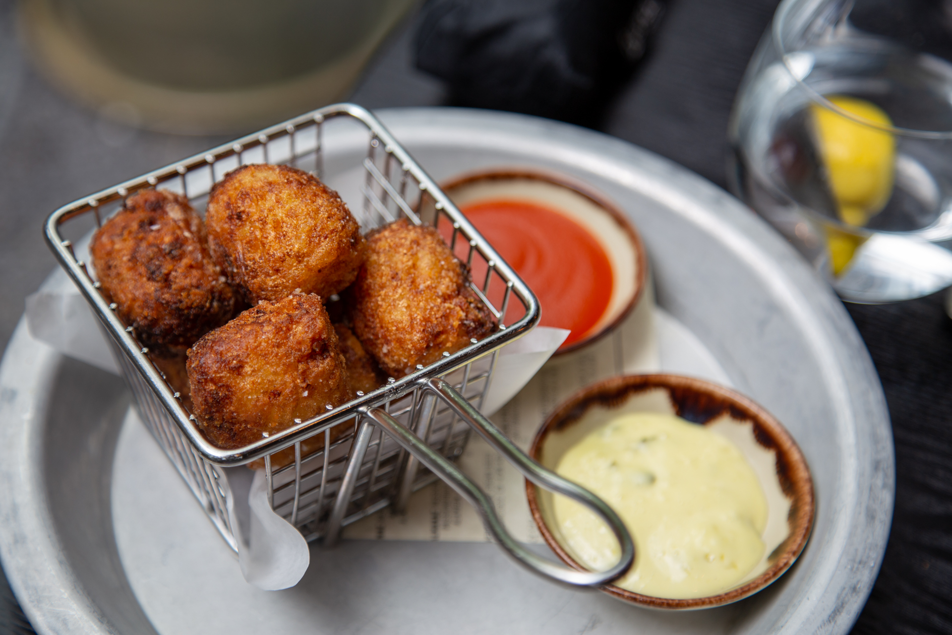 ALX's housemade tater tots are stuffed with chevre goat cheese.
