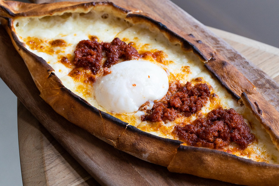 Whatever you do, you must order at least one of the three flatbreads. We fell for the pork soujuk with juicy sausage crumbles, red pepper, cheese, and a soft egg on top.