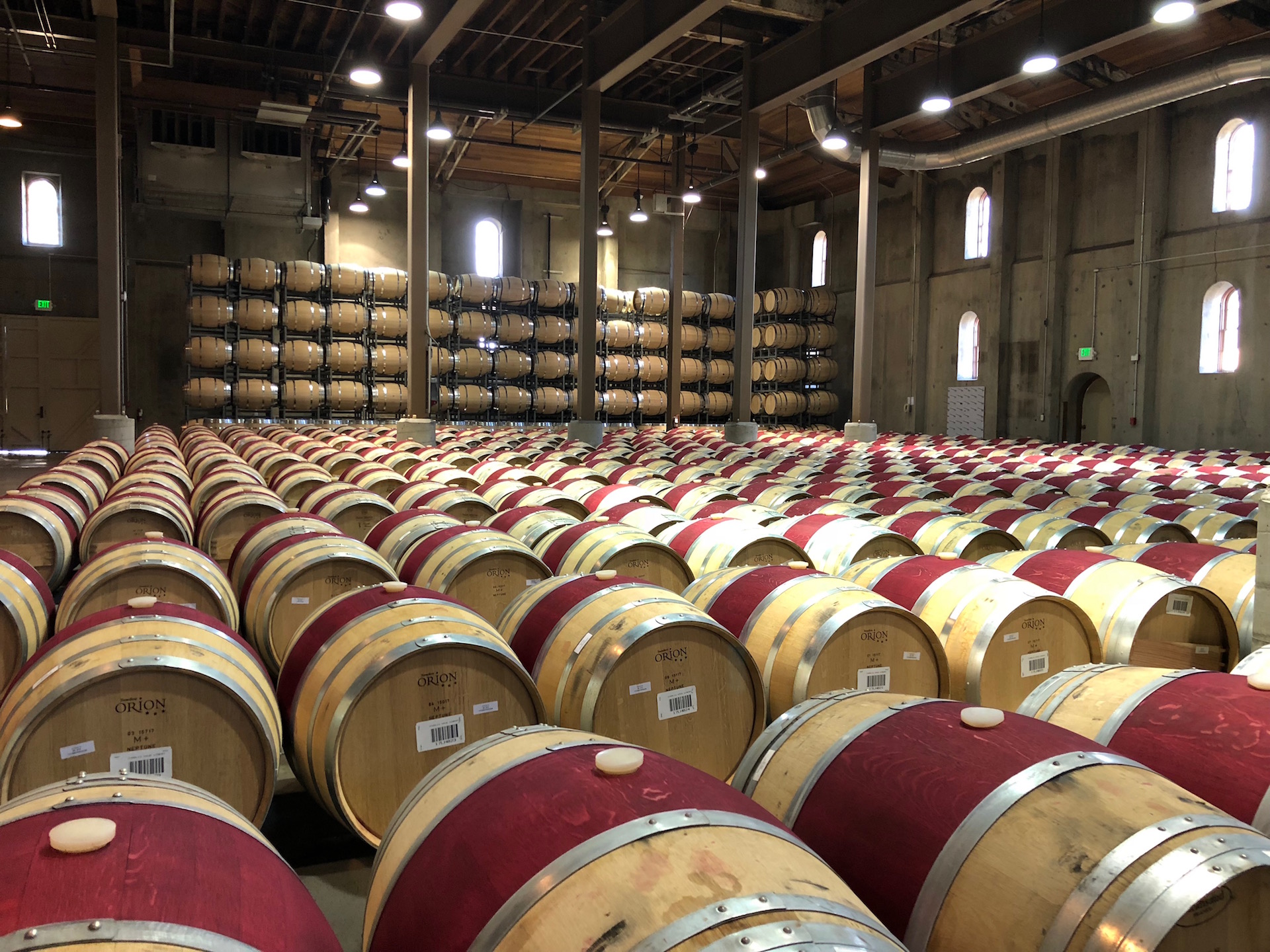 The signature burgundy painted barrels resting at Charles Krug Winery