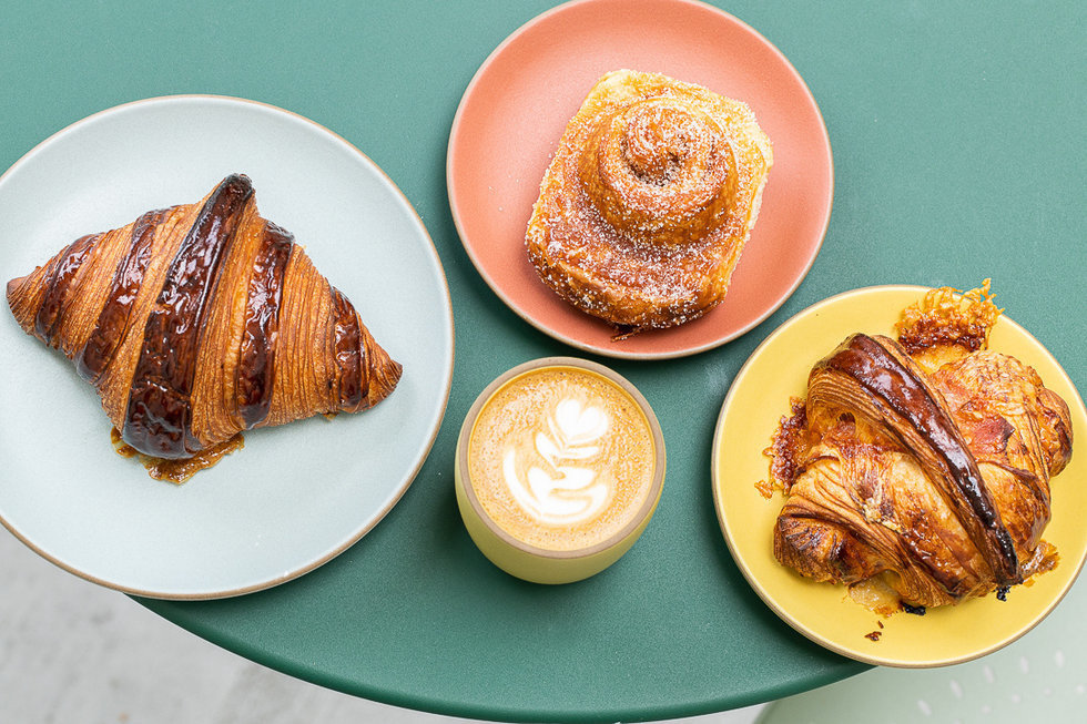 A buttery croissant, the legendary morning bun, and a ham-and-cheese croissant at Tartine in the Inner Sunset.