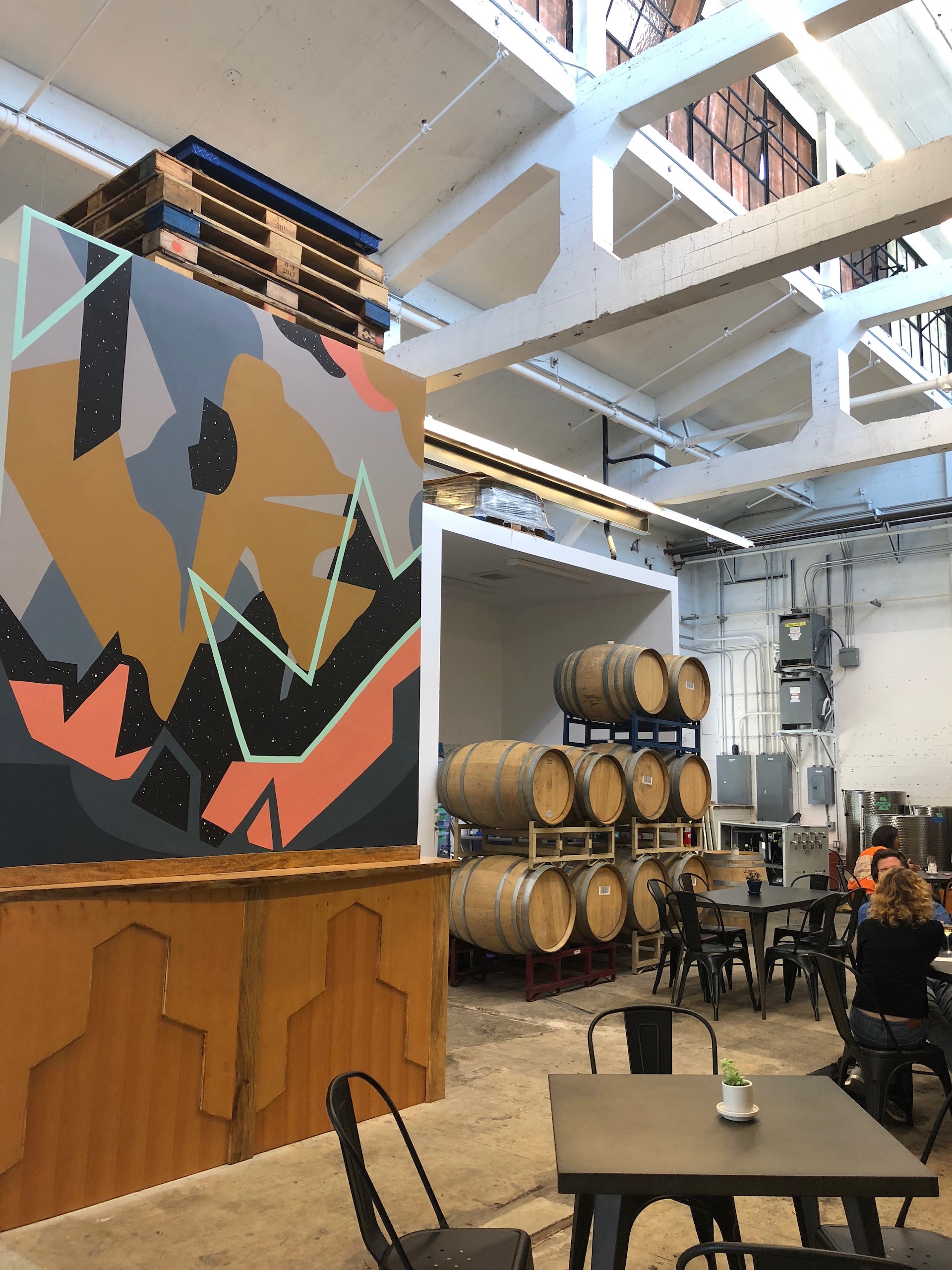 The artsy-industrial interior of Berkeley newcomer Bue Ox Wine Co.
