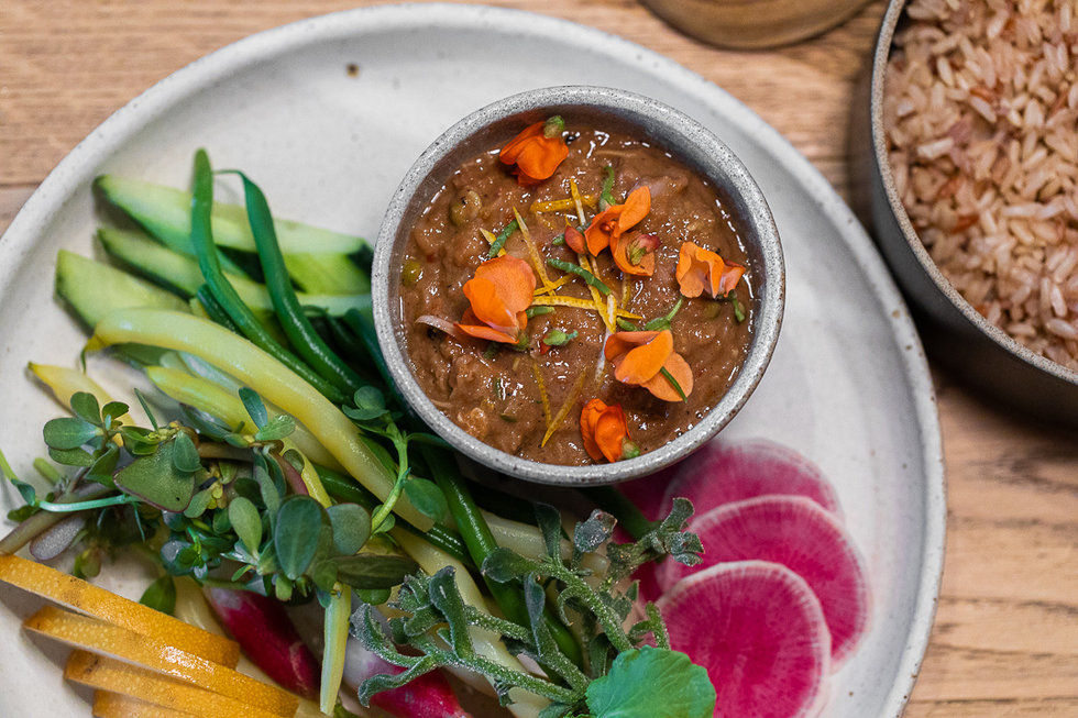 The kapi plah is an intensely flavorful chilled dip is made with gulf prawns and shrimp paste relish and comes with a spread of crisp radishes, beans, and sliced pear.