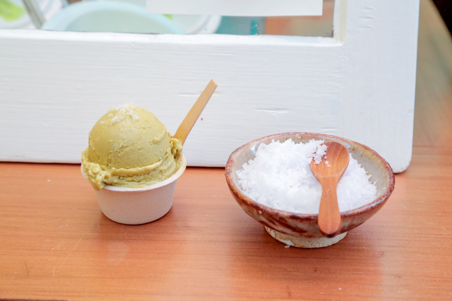 A scoop of pistachio sorbet is served with some Maldon salt.