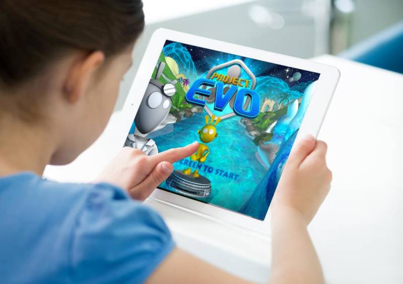 A child plays with Project: EVO, a video game software.