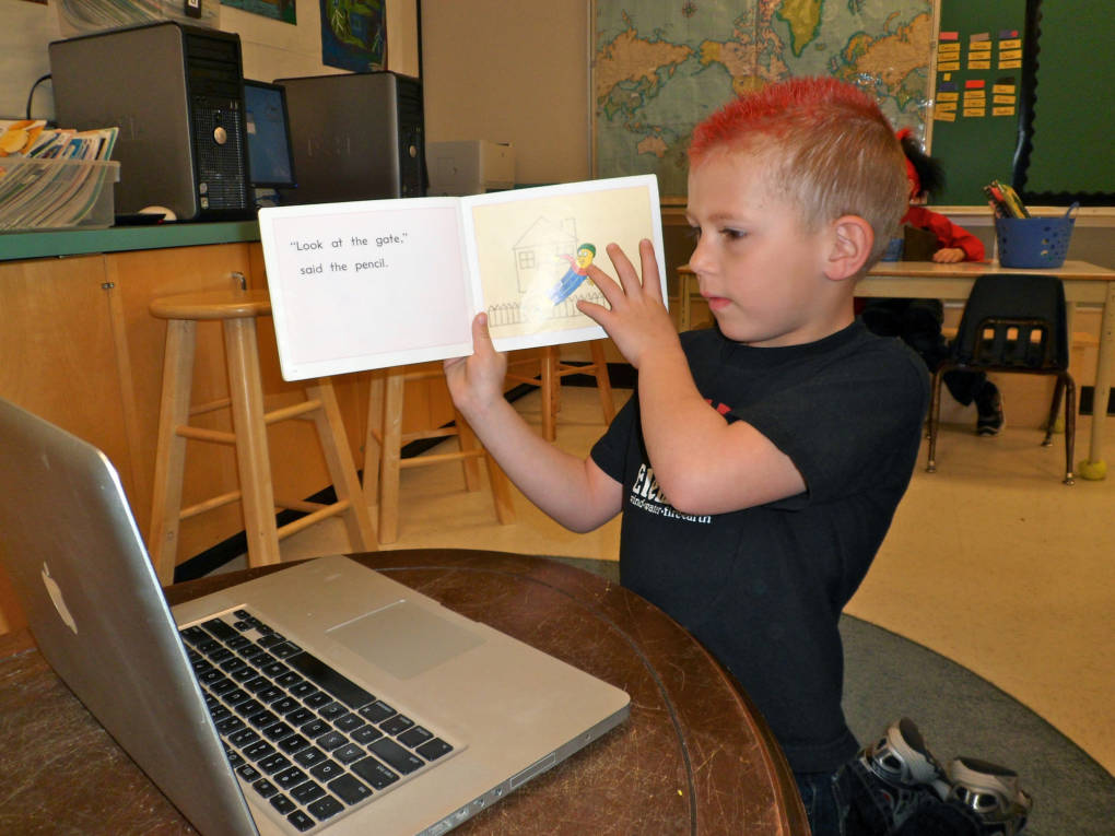 A student practices reading with his Skype partner.