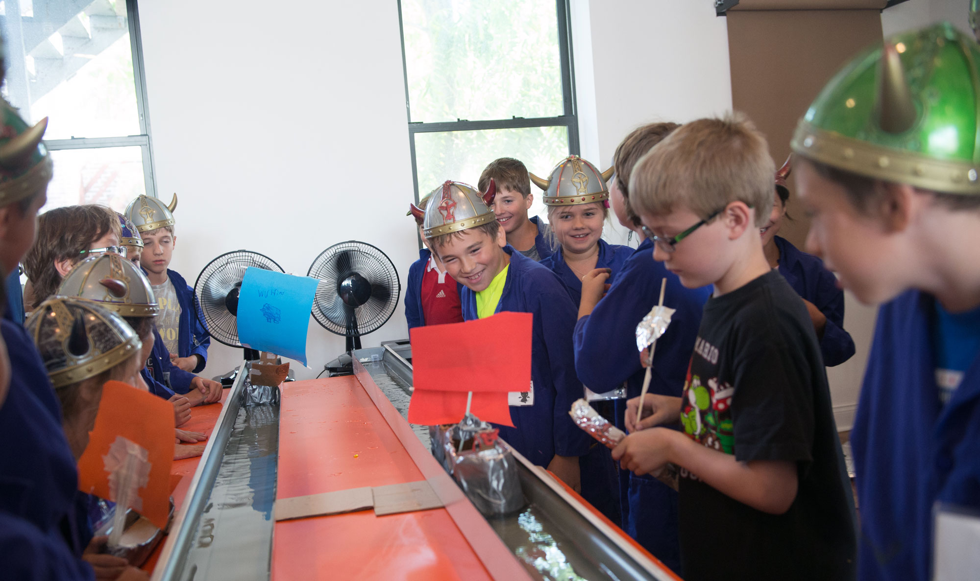 During "On Training Your Dragon" camp, students learn about the Vikings and the science behind dragons and magical species. They used Newton’s laws of motion and design-thinking to create a better Viking boat, testing it out in racing challenges against other clans.
