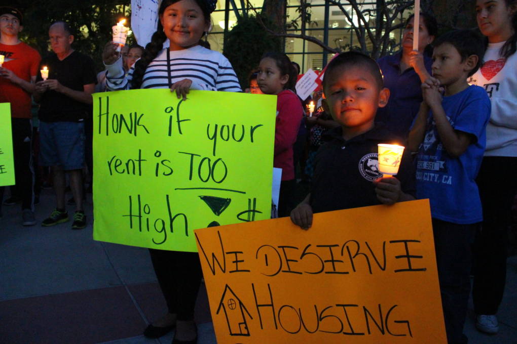 Giselle Penuela, 10, and Alexander Penuela, 6 attend an October 2015 vigil in Redwood City outside the City Council chamber calling for rent control and other renter protections.