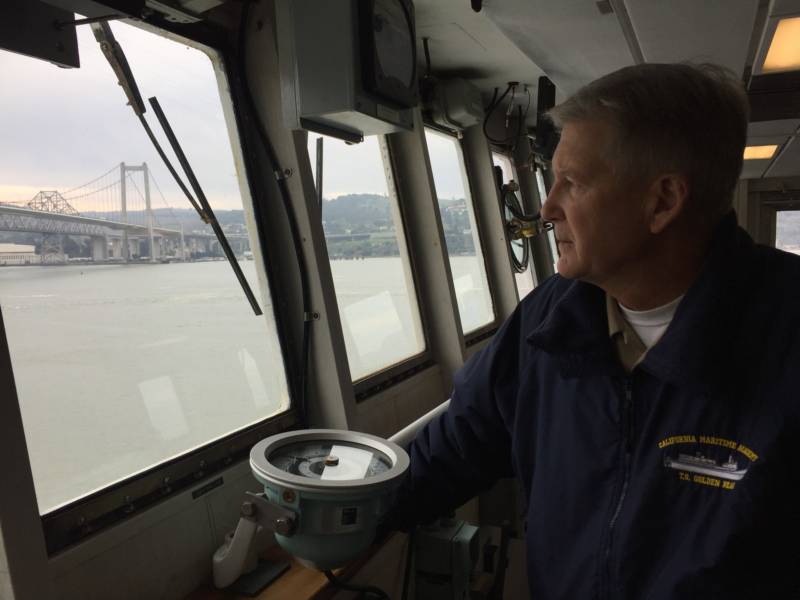 Training Ship Golden Bear's Captain Harry Bolton looks out from the ship's bridge.