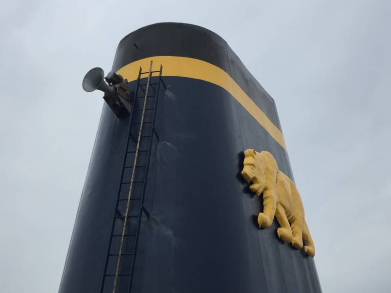 The smoke stack of the Training Ship Golden Bear is adorned with a foghorn and a golden grizzly bear. The over 10,000-ton ship serves as a training vessel for students attending California State University Maritime Academy.