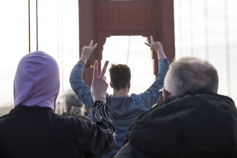Protestors gathered across the Golden Gate Bridge at about 10 a.m. on Jan. 20, 2017. The participants linked hands while cheering and wearing purple. Their demonstration acted as a message against President Donald Trump.