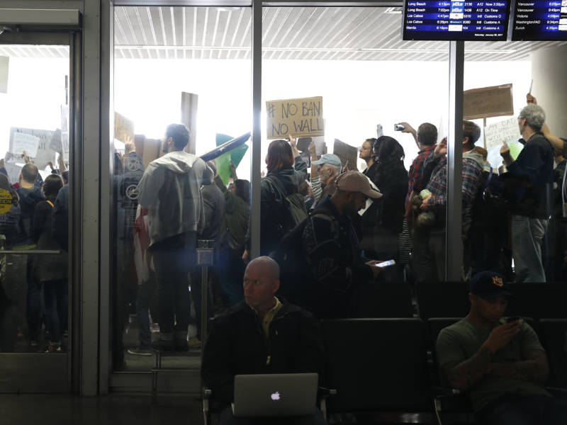 People at the international arrival terminal at San Francisco International Airport protest President Trump's executive order on immigration on Saturday.