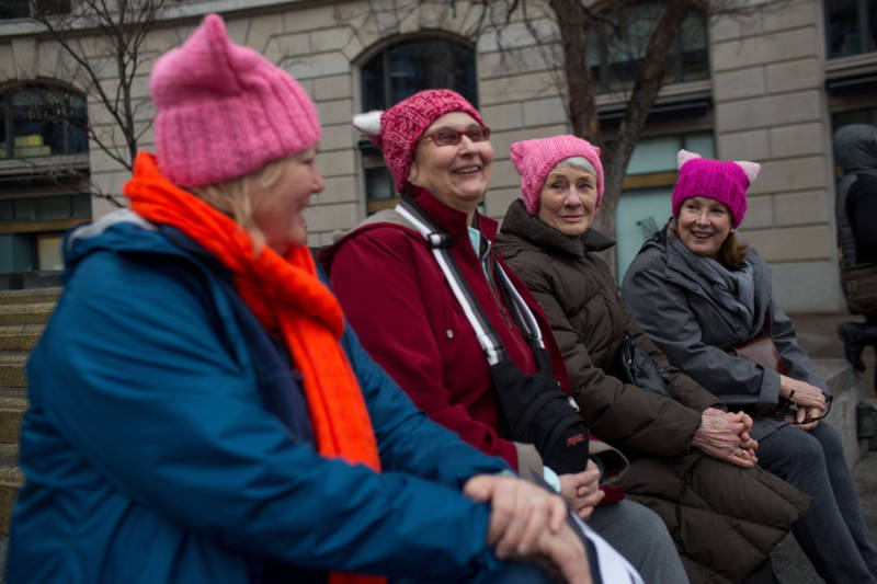 (Left to right) Melissa Breen, Laura Jamison, Sandy Cuza and Kathryn Wehrmann chat while sporting matching pink hats in support of the march.