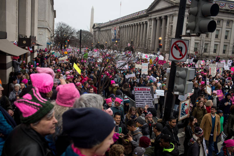  Protestors march near the U.S. Department of the Treasury.