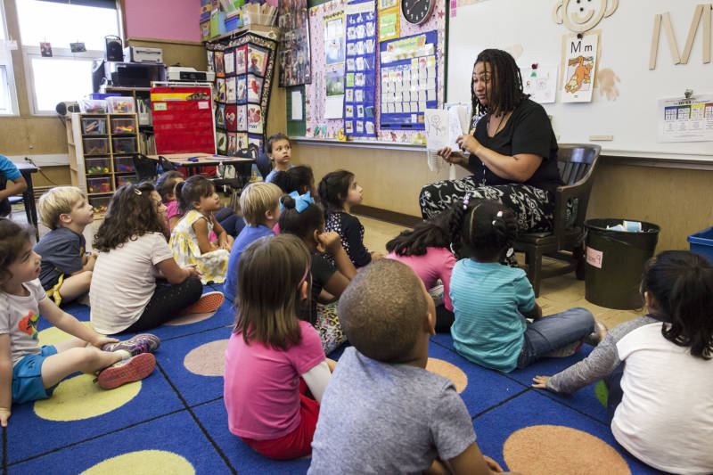 Tontra Love, a transitional kindergarten teacher at Sequoia Elementary School in Oakland, reads to her students at the end of class. 
