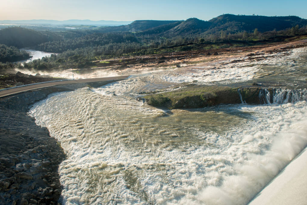 Water flows down the auxiliary spillway at Oroville Dam on Saturday. Florence Low/California Department of Water Resources