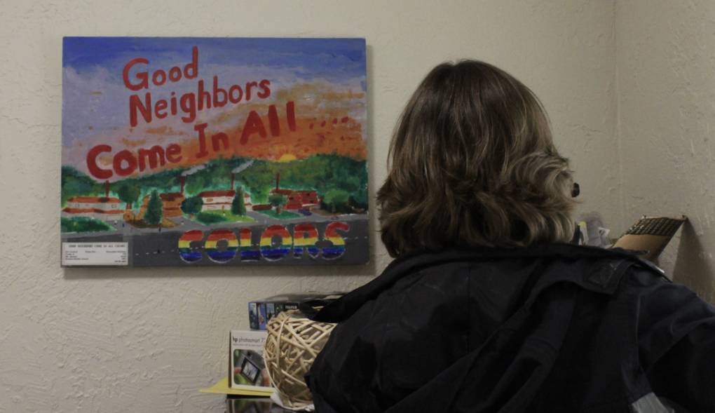 A painting that reads "Good neighbors come in all colors" hangs in the office at Fair Housing Advocates of Northern California, which was formerly known as Fair Housing of Marin. 