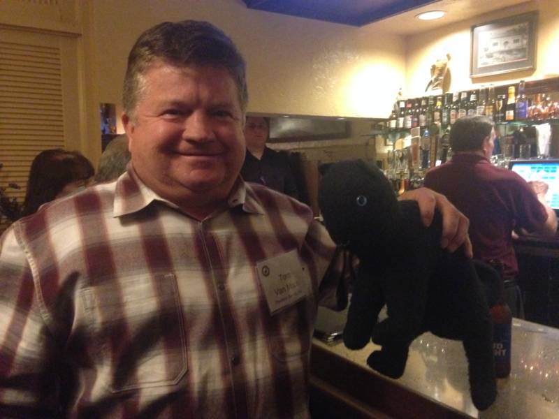 Tom Von Moos and a stuffed black cat.