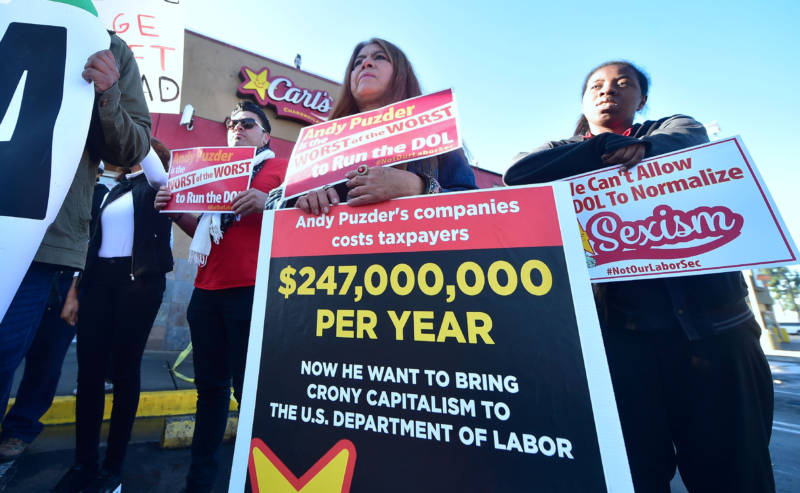 Fast-food workers protest Andrew Puzder Labor secretary nominee on January 26, 2017 in Los Angeles.