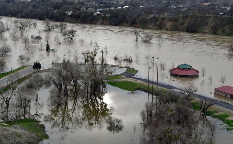 Riverbend Park is seen under flood water in Oroville, California on February 13, 2017. .Almost 200,000 people were under evacuation orders in northern California Monday after a threat of catastrophic failure at the United States' tallest dam. Officials said the threat had subsided for the moment as water levels at the Oroville Dam, 75 miles (120 kilometers) north of Sacramento, have eased. But people were still being told to stay out of the area. 