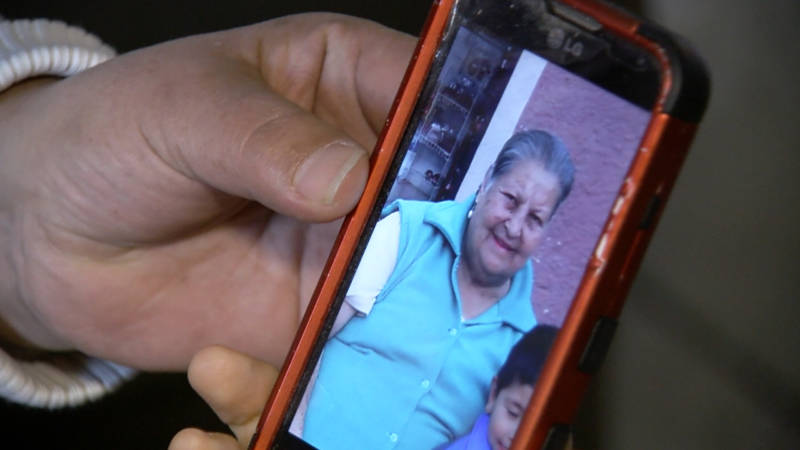 Teresa Gomez shows a picture of her mother, Carmen. 'I send her $400 every two weeks,' said Gomez, who has dual U.S.-Mexico citizenship. 'I provide for my mother.'