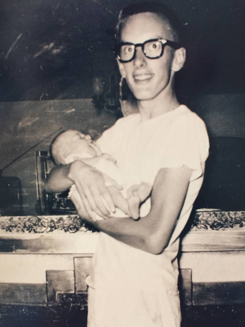 Gary Fisher holding his daughter, Bess.