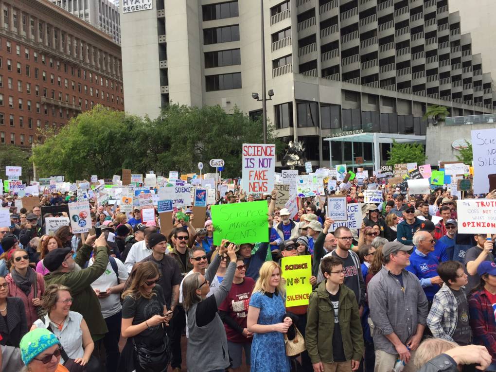 Many hold signs at the March for Science in San Francisco