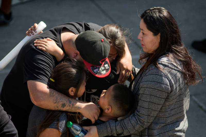 North Park Elementary School students and parents are reunited after a shooting at their school on April 10, 2017 in San Bernardino.