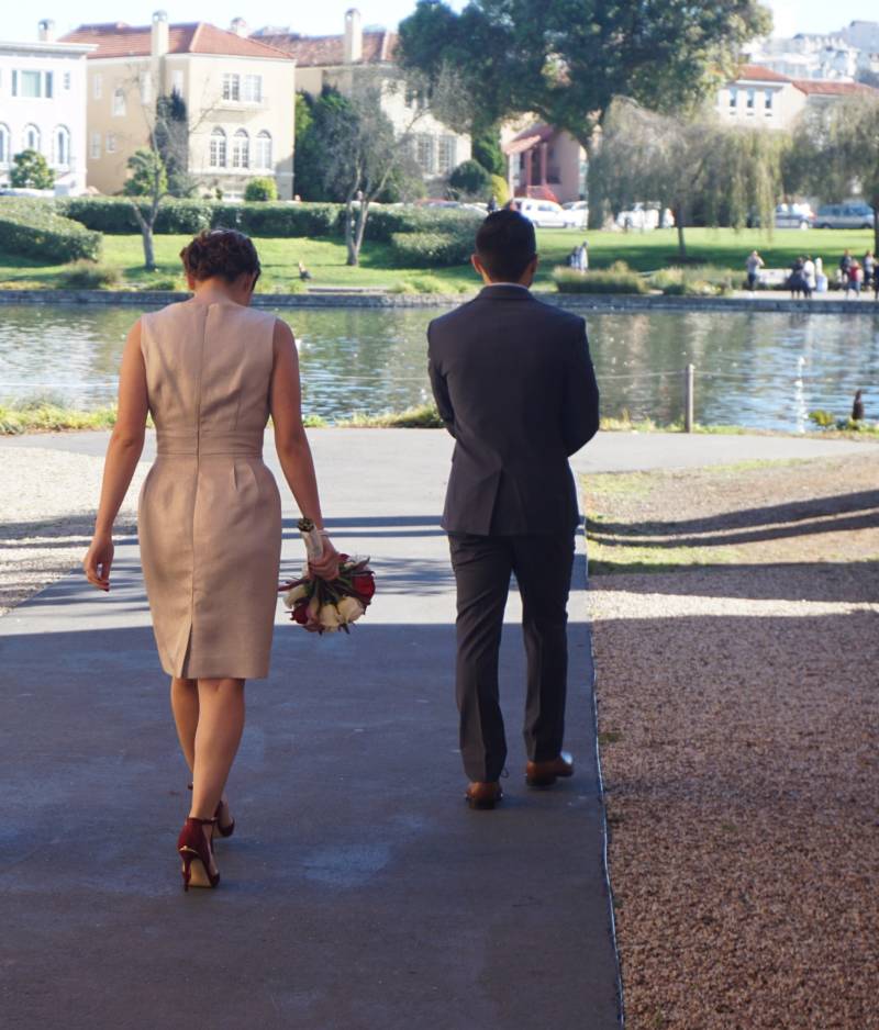 Olivia and Jacob walk together after their civil ceremony at the Palace of Fine Arts in December 2016.
