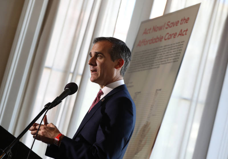 Los Angeles Mayor Eric Garcetti speaks during a town hall on the Affordable Care Act in Los Angeles on Feb. 22. Garcetti said he's trying to quell fears stoked in the city's immigrant communities by President Trump's calls for more cooperation between local law enforcement and federal immigration authorities.