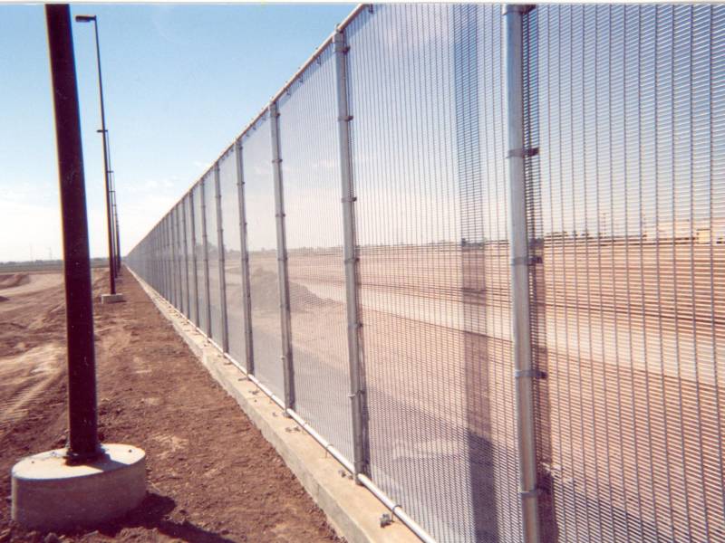 The WireWall fence now in place in California on the border with Mexico. Riverdale Mills says the fence is produced using the same manufacturing process as its "marquee marine wire mesh" designed for lobster traps used in New England.