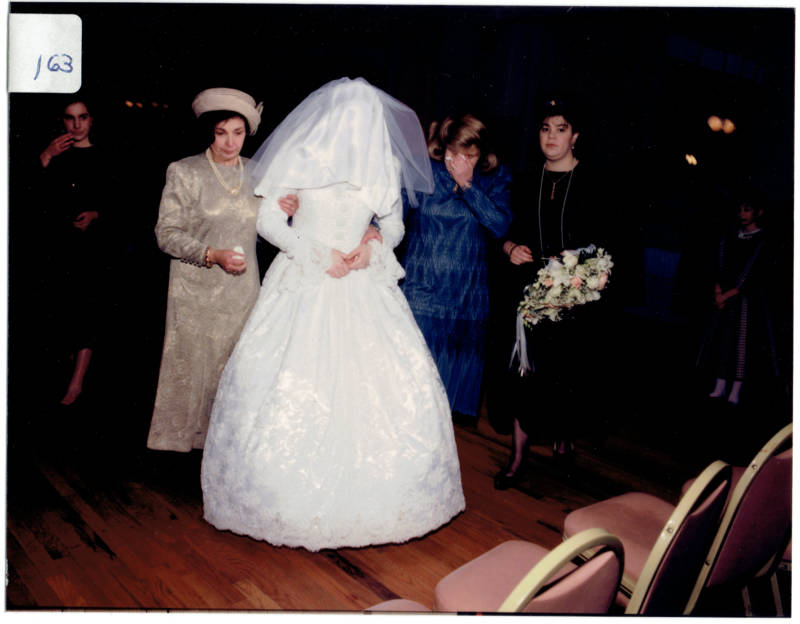 Henny Kupferstein concealed by her veil on her wedding day. 