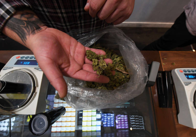 A salesman prepares an order at a medical marijuana dispensary in Los Angeles.