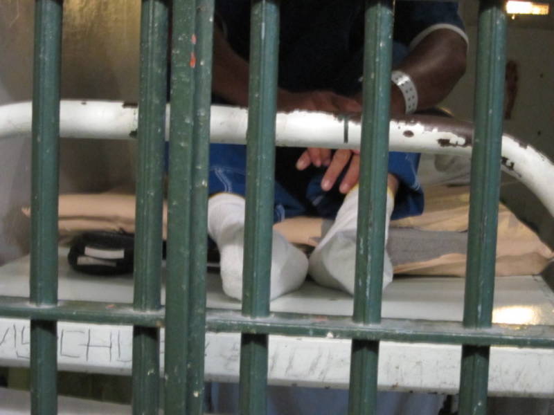 An inmate sits in his cell in LA County Jail. 