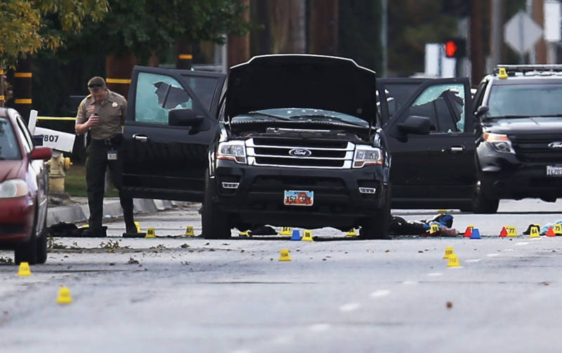 Investigators survey the SUV driven by Syed Farook and Tashfeen Malik after their Dec. 2, 2015, attack in San Bernardino.