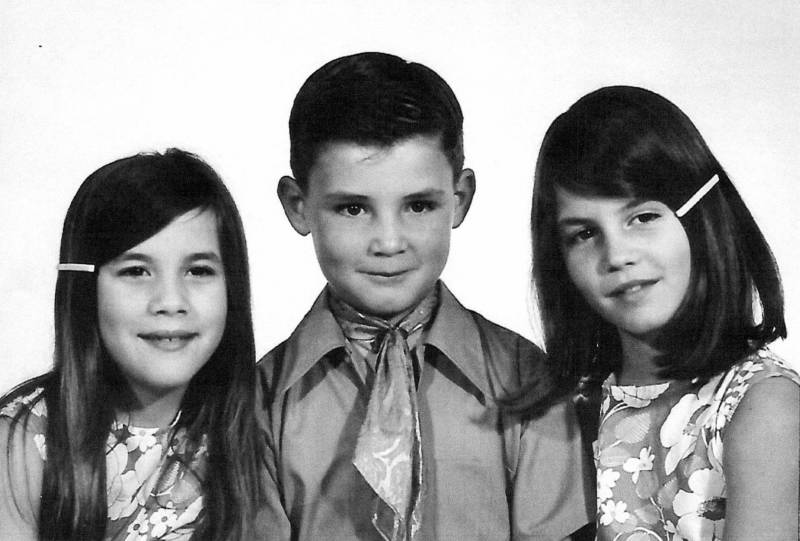 Cassie Riley (right) pictured at age 13 with her siblings.