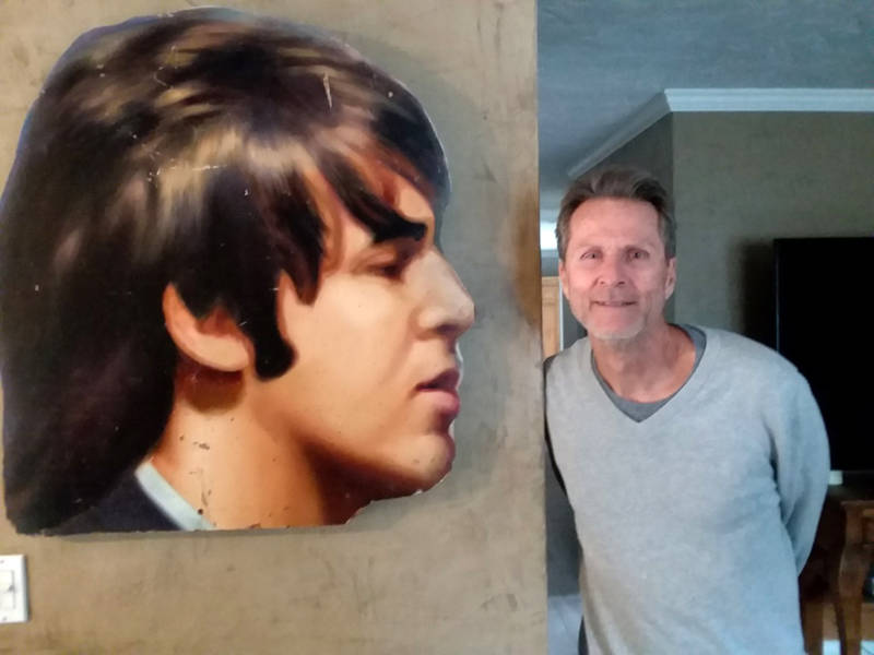 Robert Quinn with Paul McCartney's head, which was cut off from the 'Abbey Road' billboard.