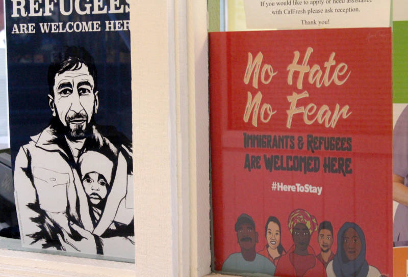 The offices at Catholic Charities of the East Bay display posters welcoming refugees.